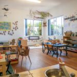 Toddlers room with natural light, learning stations, and nature-inspired decor at Albany childcare centre