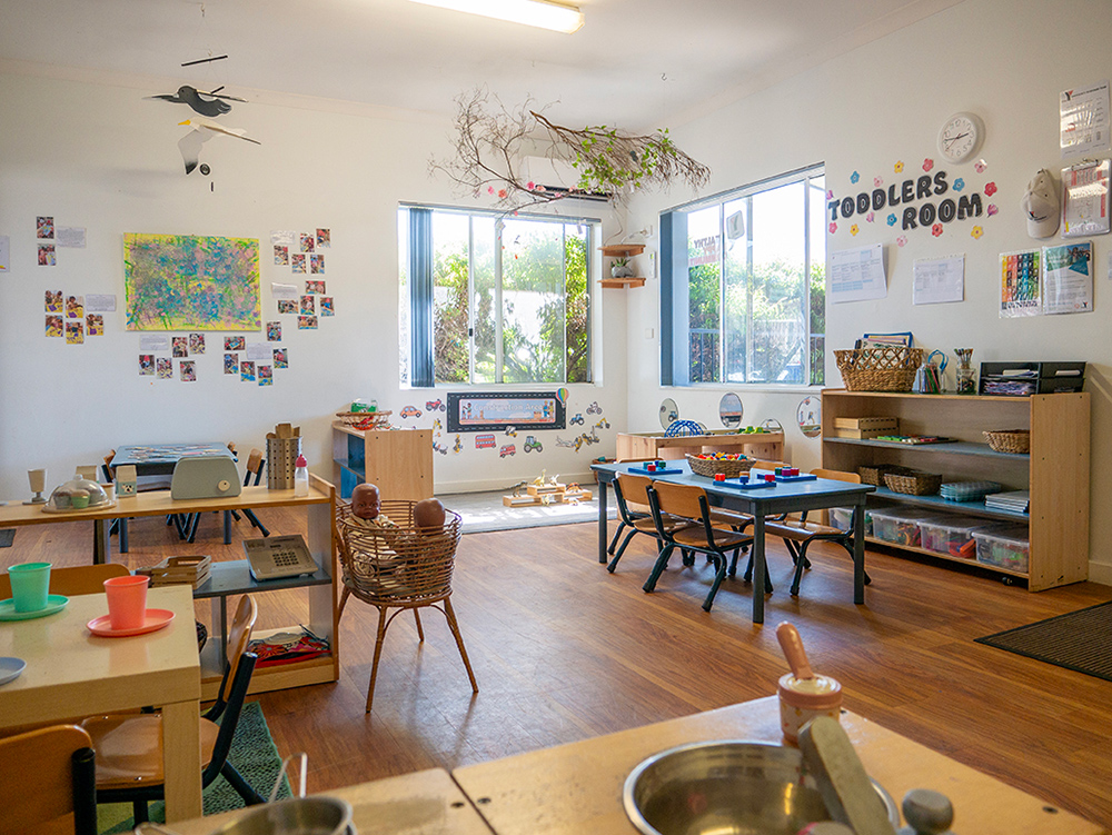 Toddlers room with natural light, learning stations, and nature-inspired decor at Albany childcare centre