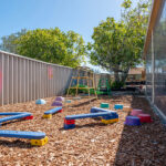 Step and balance play equipment in outdoor playground at Albany childcare centre