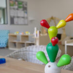 Colorful wooden balancing cactus toy in a playroom at Brabham childcare centre