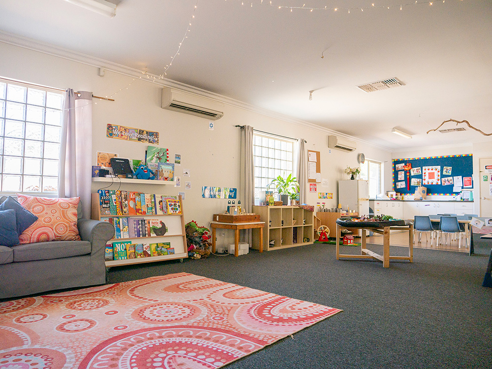 Bright learning space with reading corner and activity zones at East Cannington childcare centre
