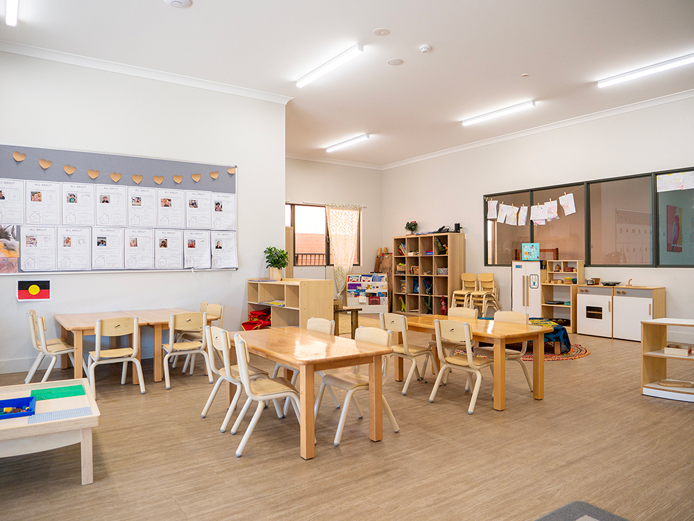 Bright learning environment with Aboriginal flag and organised activity zones at Kalgoorlie centre