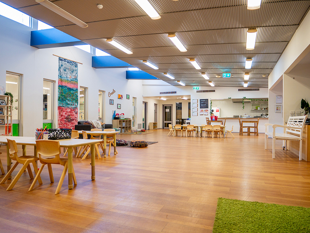 Expansive indoor space with natural light and timber features at Newman childcare centre