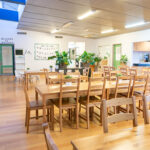 Large room with table chairs, and other furniture at Port Hedland Early Learning Centre