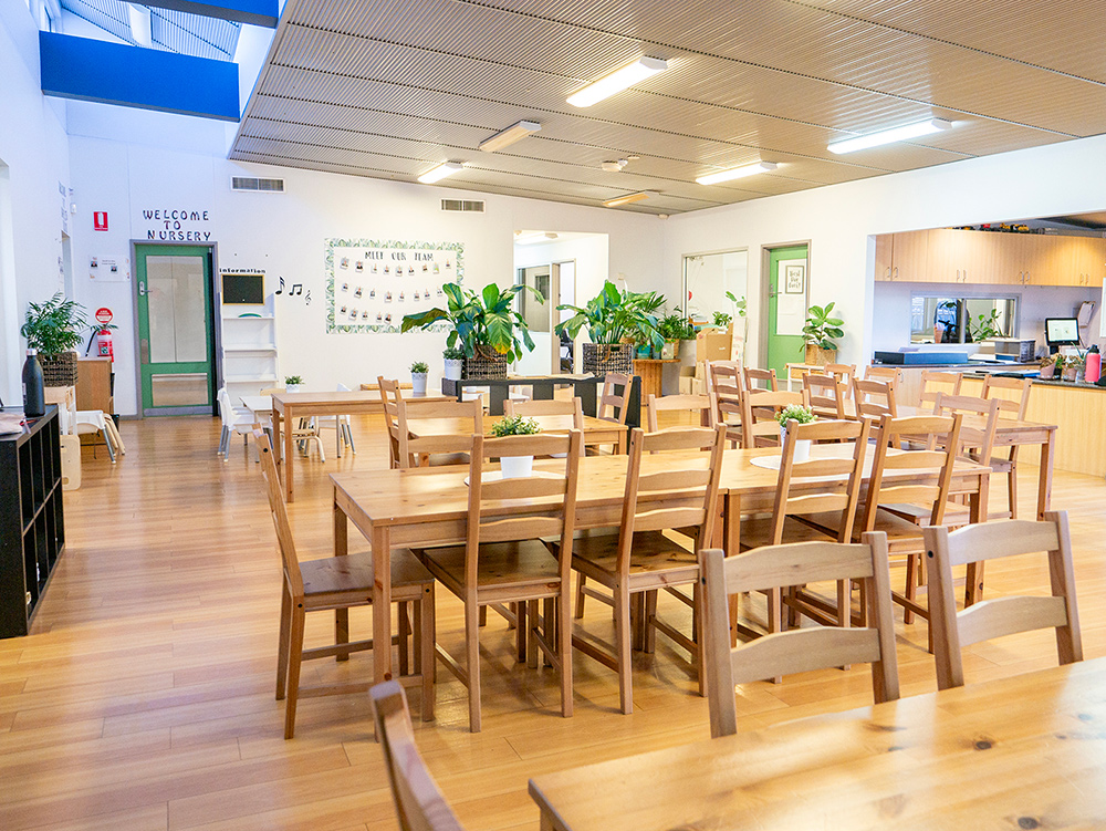 Large room with table chairs, and other furniture at Port Hedland Early Learning Centre