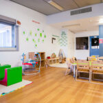 Play area with age appropriate toys at children's artwork at Port Hedland Early Learning Centre