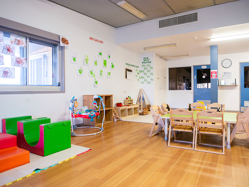 Play area with age appropriate toys at children's artwork at Port Hedland Early Learning Centre