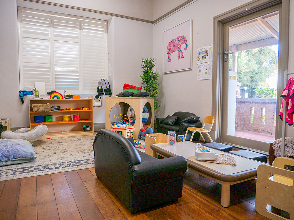 Inside play room with furniture and toys at Yappara House Early Learning Centre