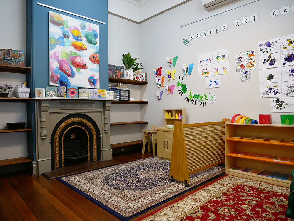 Inside play room with furniture, toys and art at Yappara House Early Learning Centre