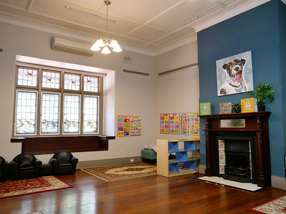 Inside chill out room with furniture and artwork at Yappara House Early Learning Centre