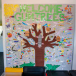 A colourful welcome sign at Gumtrees OSHC Service that is decorated with children’s names