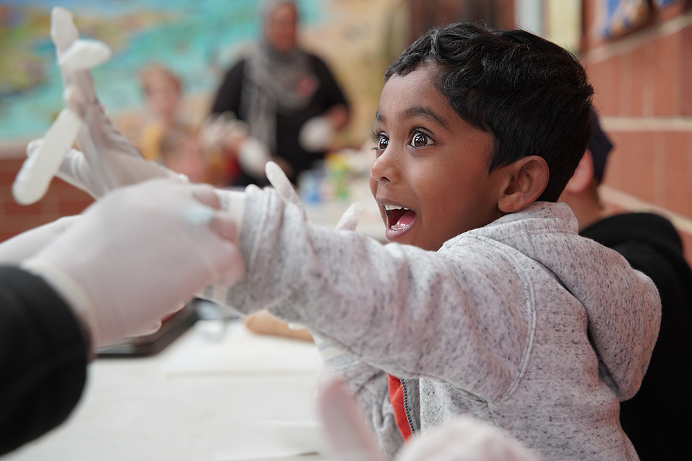 Excited child having fun during activity at Currambine OSHC School Holiday Program