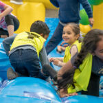 Children playing on bouncy castle at Huntingdale OSHC School Holiday Program