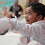 Excited child having fun during activity at Kalgoorlie OSHC School Holiday Program