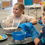 Children making pasta during cooking activity at Lake Gwelup OSCH School Holiday Program