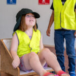 Child sitting in go-kart at Mercy OSHC School Holiday Program