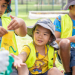 Children during a gardening activity at Riverton OSHC School Holiday Program