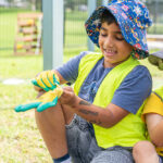 Children during a gardening activity at Riverton OSHC School Holiday Program
