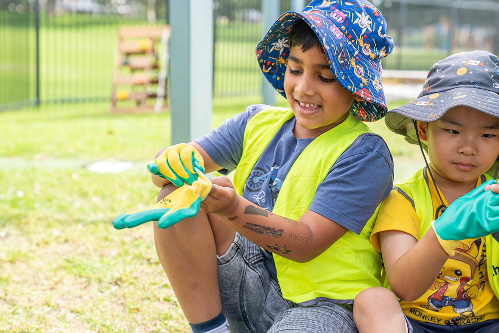 Children during a gardening activity at Riverton OSHC School Holiday Program