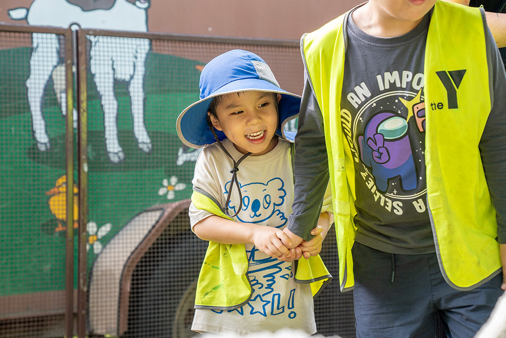 Children exploring Old Macdonald's Travelling Farm during Sacred Heart OSHC School Holiday Program