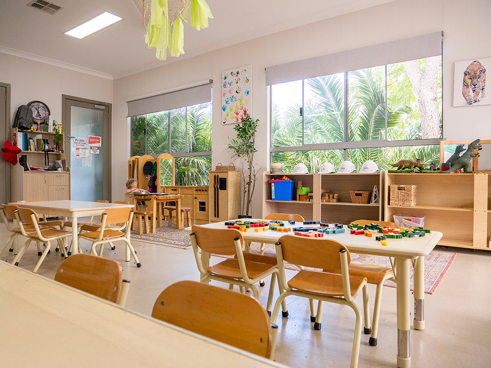 Room with tables, chairs, and other play equipment at Yappara House Early Learning Centre
