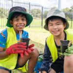 Children potting plants during an activity at Riverton OSHC School Holiday Program