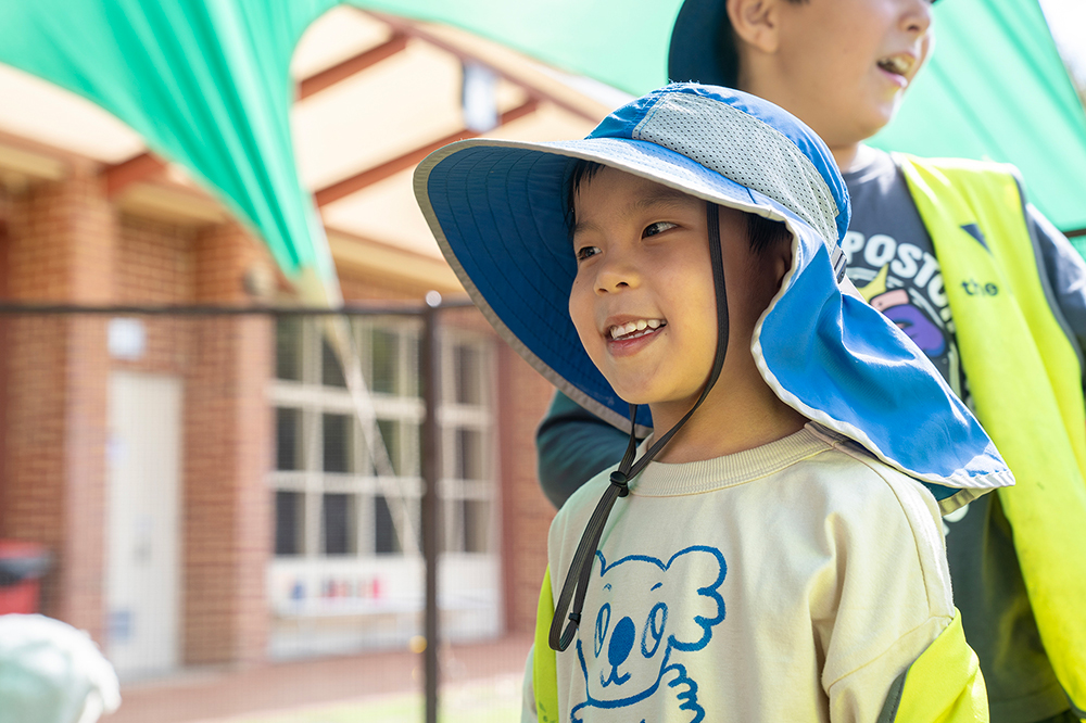 Child smiling at Sacred Heart OSHC School Holiday Program