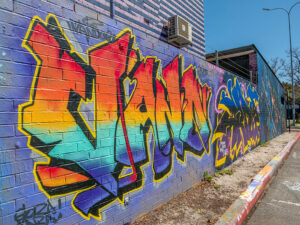 Large scale street art mural on wall at the Y HQ in Leederville