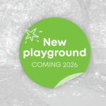 A promotional graphic announcing a new playground coming in 2026, overlaid on a greyscale photo of an existing children's play area