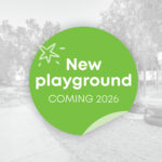 A promotional graphic announcing a new playground coming in 2026, overlaid on a greyscale photo of an existing children's play area