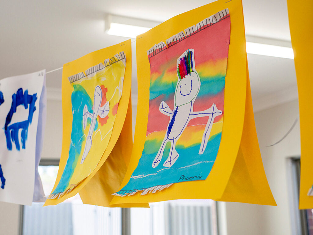 Close up image of artwork drawn by a child hanging on display in early learning centre