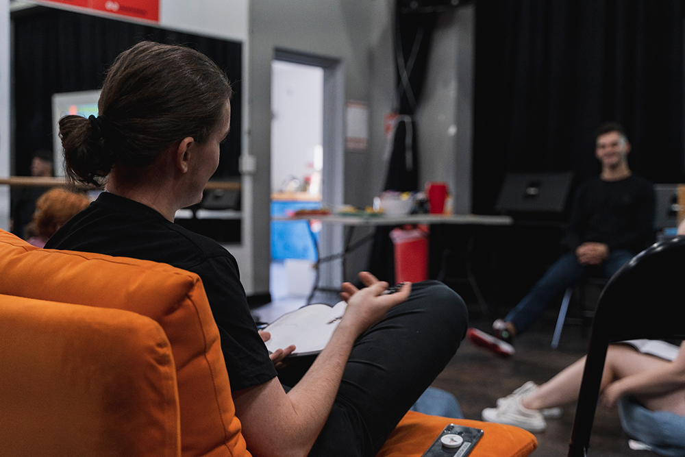 Group of young people working together in a room