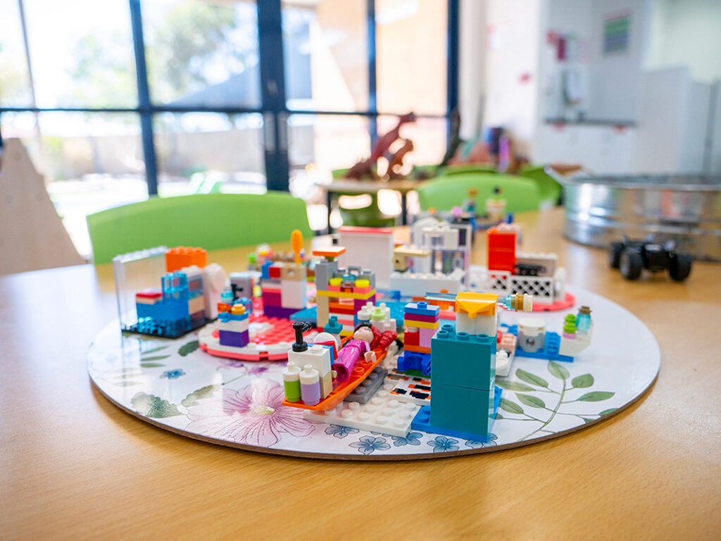 Close up image of Lego built on a table at an early learning centre