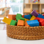 Close up image of blocks in tweed basket on table