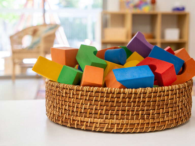 Close up image of blocks in tweed basket on table