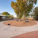 Outside play circle with trees and toys