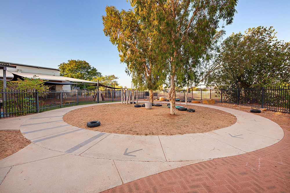 Outside play circle with trees and toys