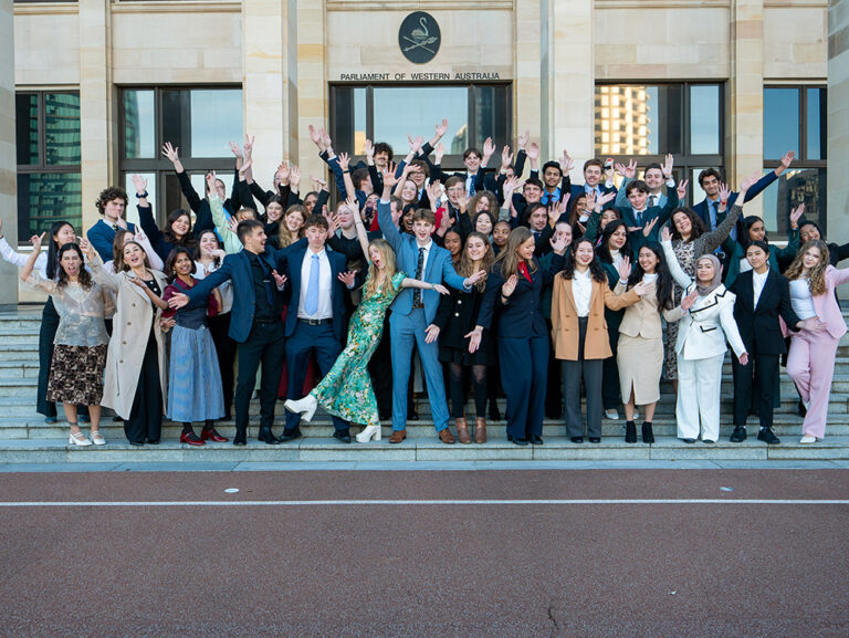 Group of excited young people out the front of the Parliament of Western Australian after engaging in the Youth Parliament program