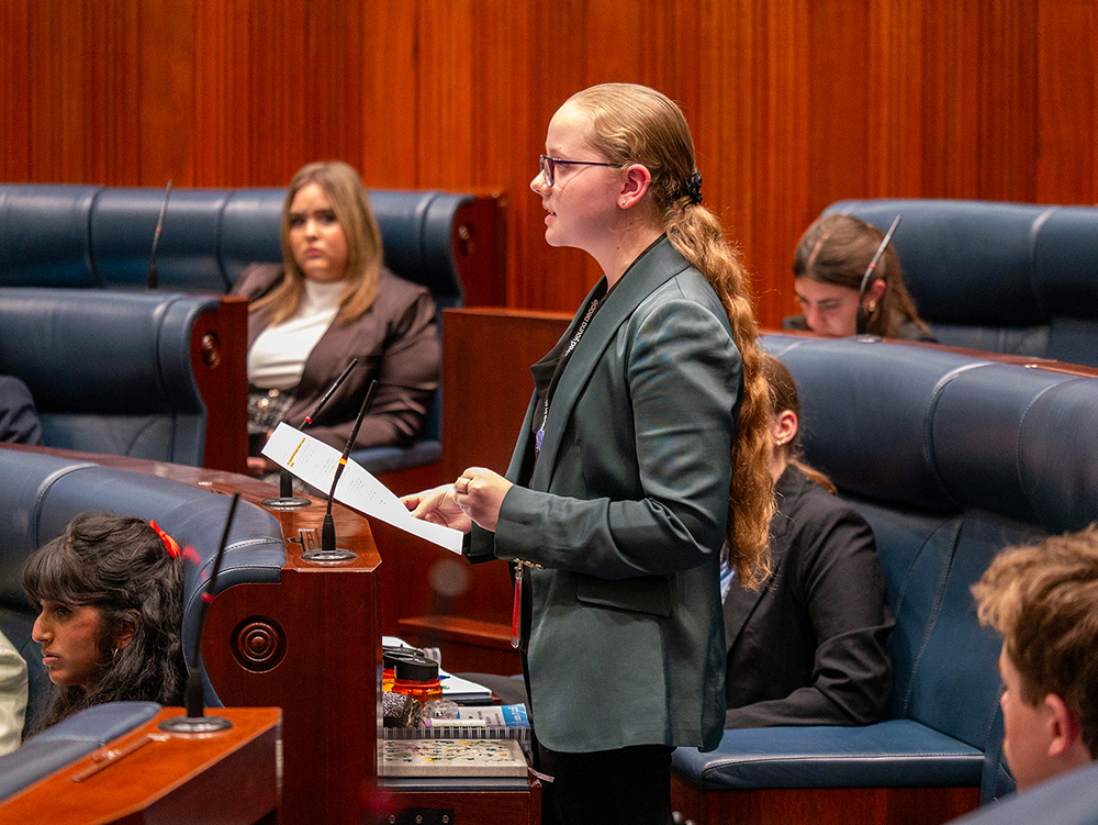 Young person giving a speech in the chambers of the Parliament of Western Australia during the Youth Parliament adjournment debate