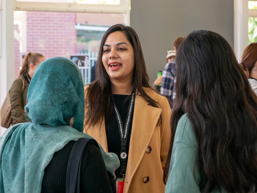 Group of young people engaging in conversation outside the the Parliament of Western Australian