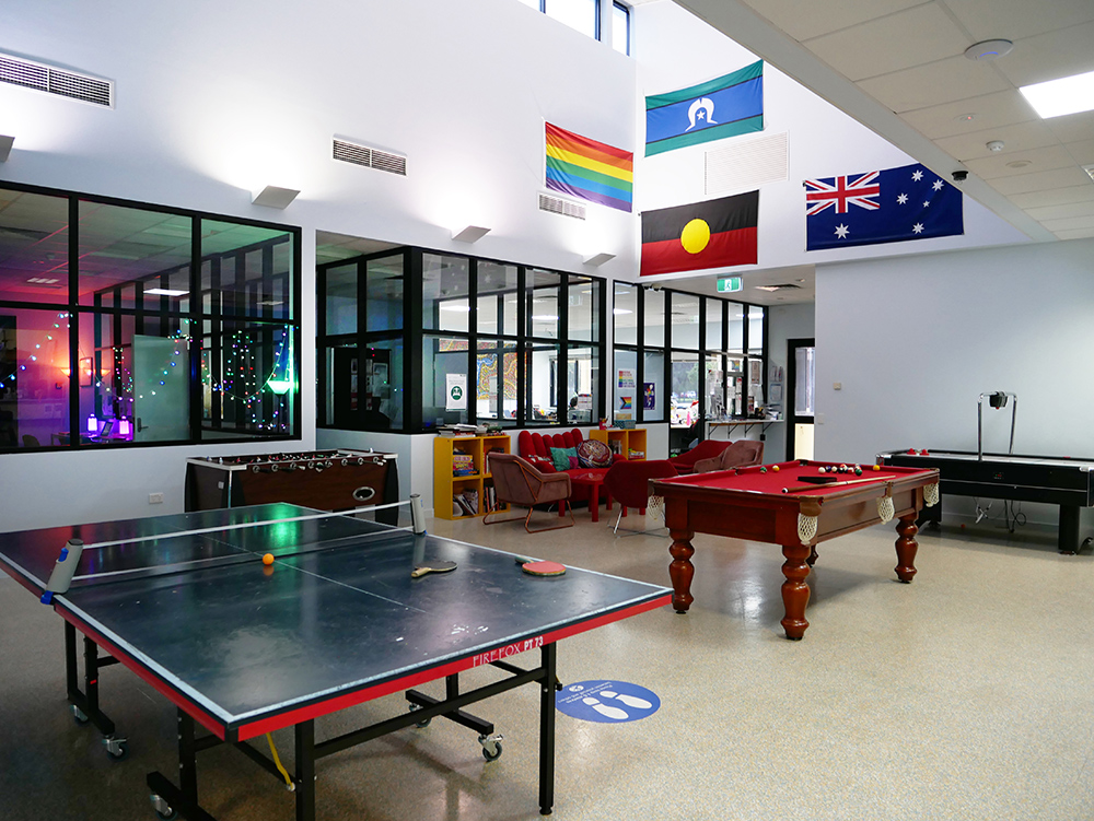 Large games room with ping pong table, pool table, fuseball table and air hockey table