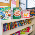Children's bookshelf with diverse reading materials including Indigenous and multicultural titles