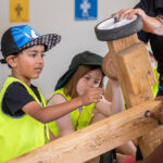 Children collaborating on a go-kart project during Mercy OSHC School Holiday Program