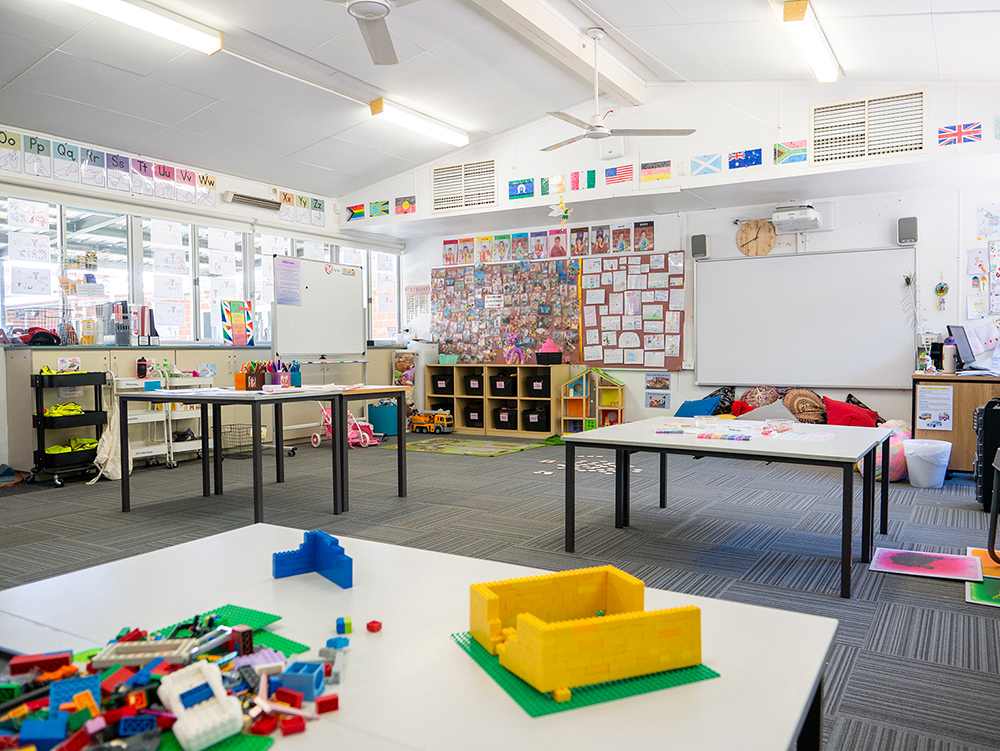 Bright OSHC classroom with Lego building activities, multicultural displays and whiteboards