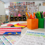 OSHC multicultural art activity with children's flag drawings and Indigenous respect colouring sheets