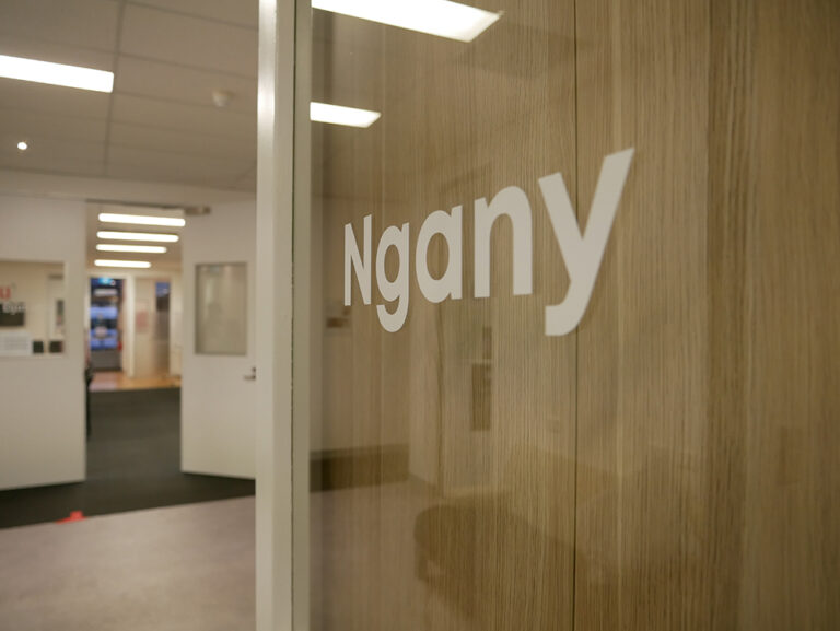 Close up shot of door with signage in Noongar language at the Y School Mirrabooka campus