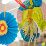 Colourful hanging lanterns and paper decorations displayed at OSHC celebration