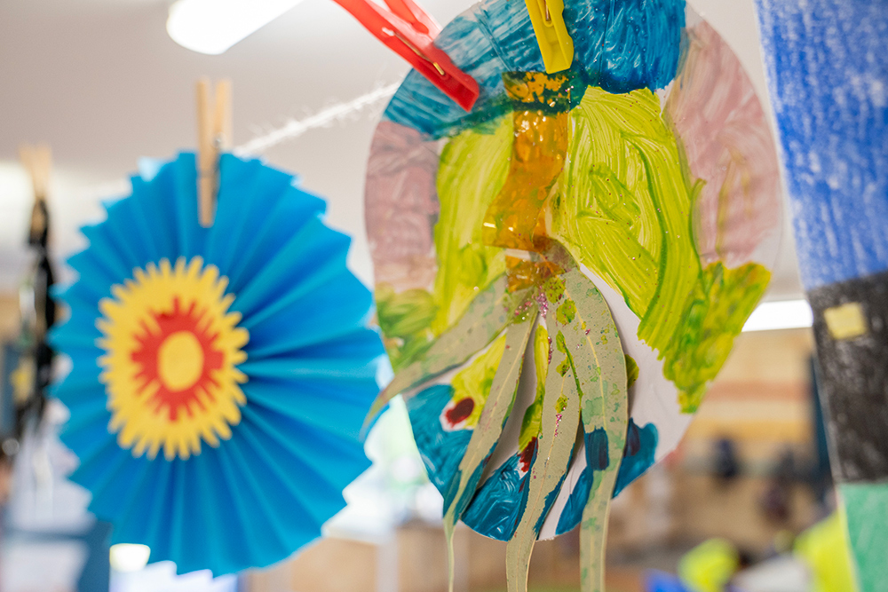 Colourful hanging lanterns and paper decorations displayed at OSHC celebration