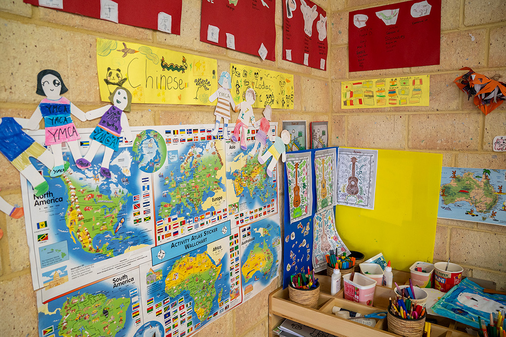 OSHC multicultural learning wall with world maps, Chinese language display and craft supplies