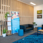 Foyer with signage and seating area at the Y School Mirrabooka 10-12 Campus